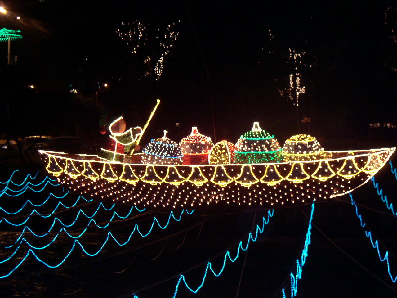 Boat-shaped Christmas lights display over the Medellín River