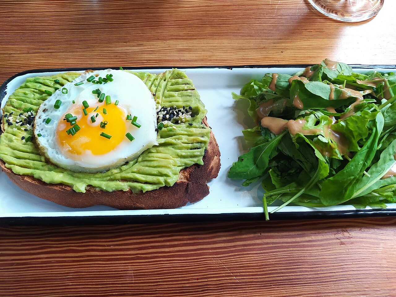 Avocado toast served with a green leaf salad