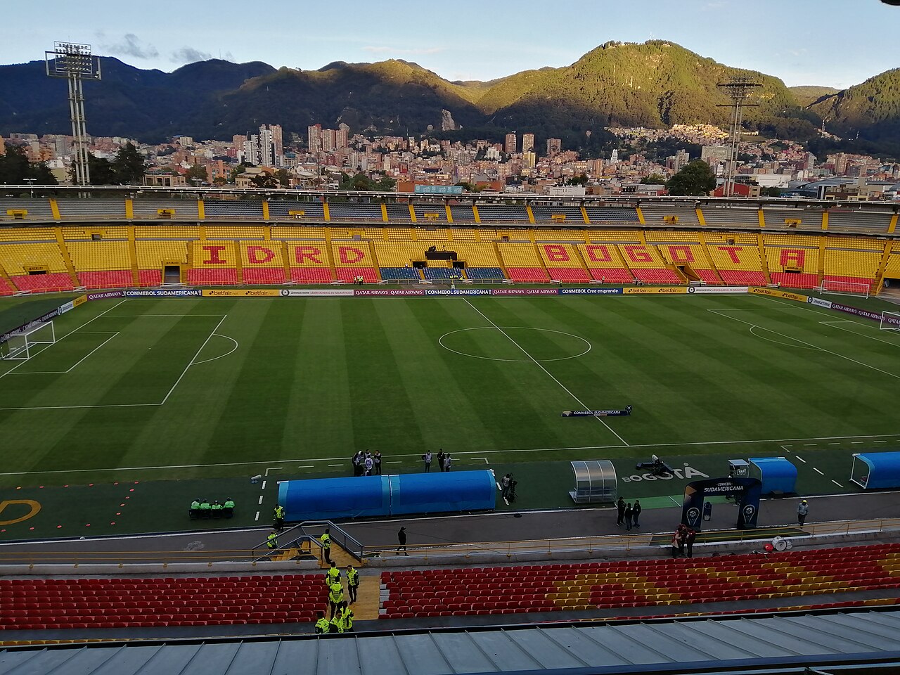 Estadio El Campín empty stands with Bogotá mountains behind